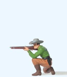 Cowboy kniend, mit Gewehr